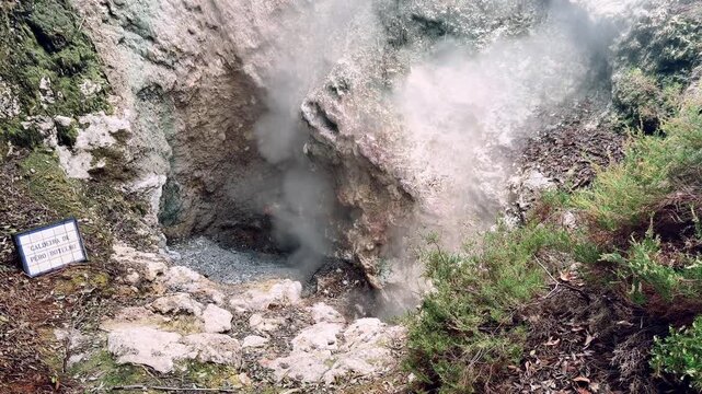 volcanic fumarole releasing geothermal steam from rocky ground in Furnas valley S&atilde;o Miguel island Azores Portugal