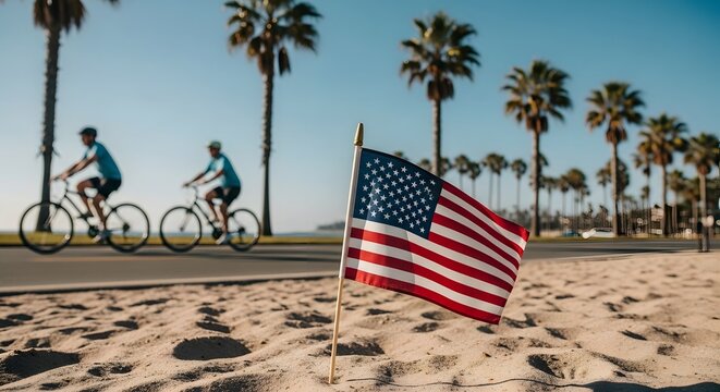 American flag on the beach with cyclists and palm trees