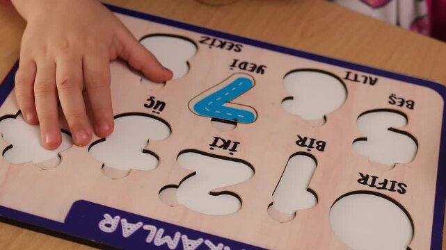 Little Child Learning Numbers with Wooden Number Board, Educational Toys for Kids