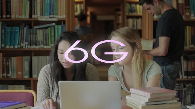 Animation of 6g text banner over two diverse girls using laptop and studying in library at college
