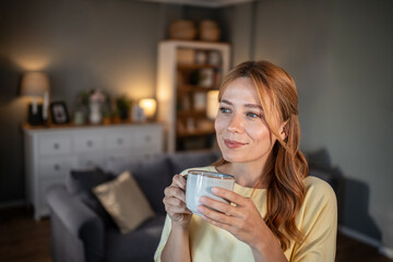 Woman enjoying morning coffee at home thinking