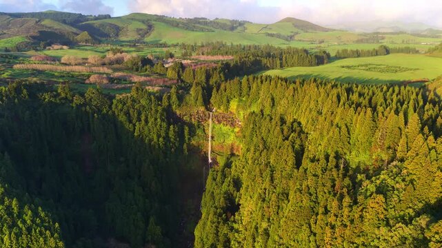 aerial view of Cascata do Grena on Sao Miguel, the Azores, travel in the Azores, Portugal, at sunrise. Azores natural environment, majestic waterfall in the Azores