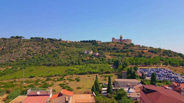 Aerial drone view of the Sanctuary of Tindari in Sicily, overlooking the stunning Mediterranean coast and lagoons. A breathtaking blend of history, faith, and Sicilian landscape from above.

