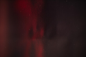 Fototapeta premium abstract red light leak on black background with scratch and dust,retro film overlay effect with red light leak,Red Film lens flare effect,Abstract Light Leak Film Poster Photo Effect Mockup