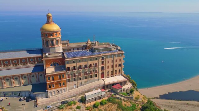 Aerial drone view of the Sanctuary of Tindari in Sicily, overlooking the stunning Mediterranean coast and lagoons. A breathtaking blend of history, faith, and Sicilian landscape from above.

