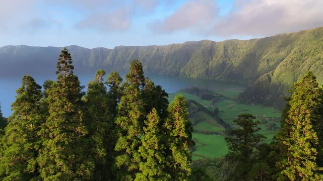 Drone shot of idyllic lake Lagoa das Sete Cidades in a volcanic caldera on Sao Miguel island, tourism in Azores, Portugal, an iconic natural landscape.