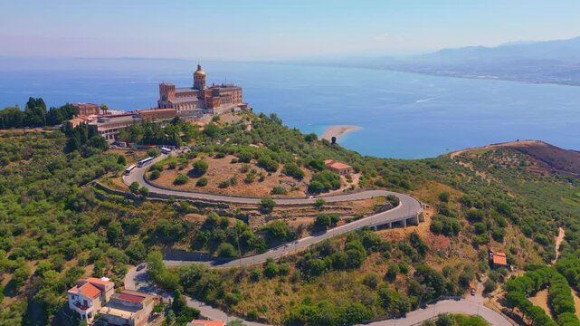 Aerial drone view of the Sanctuary of Tindari in Sicily, overlooking the stunning Mediterranean coast and lagoons. A breathtaking blend of history, faith, and Sicilian landscape from above.
