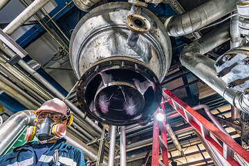 Fototapeta premium Male worker inspection weld tank, penetrant tank chemical grease