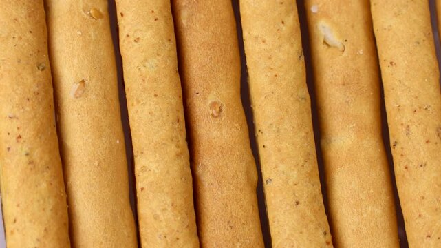 Traditional Italian breadsticks grissini circle rotation close up