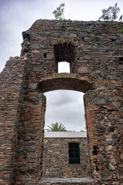 Detailed view of the San Francisco Javier Convent ruins and the Colonia del Sacramento lighthouse in Uruguay, showcasing the historic stone structure and colonial architecture.