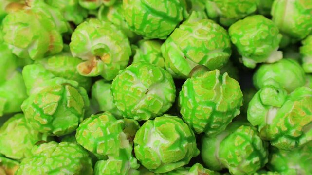 Bright green apple popcorn circle rotation close up top view