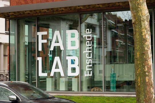Fab Lab Enschede Sign on Modern Glass Innovation Lab Building