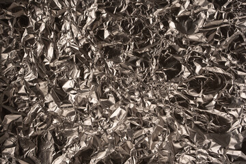 Shiny silver foil background. Top view.