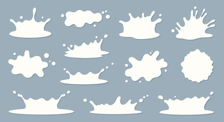 A collection of white milk splashes and spills against a blue background showcasing varied shapes and forms silhouette high quality