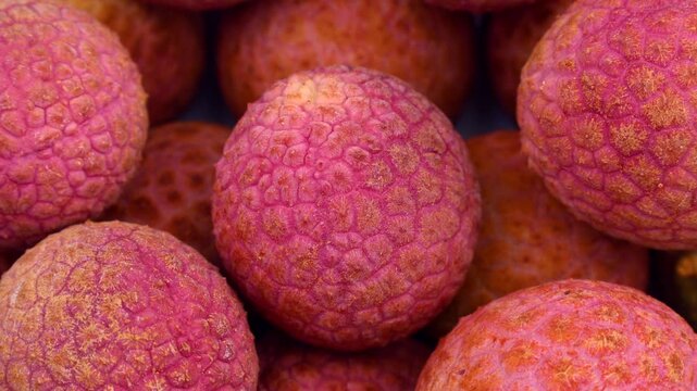 Bright red lychee fruit circle rotation close up