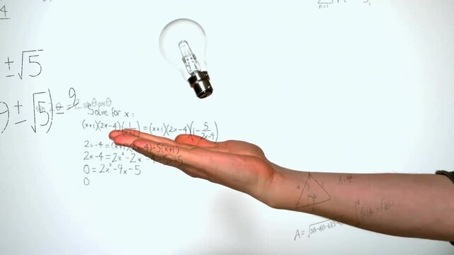 Animation of mathematical equations over caucasian man holding light bulb on white background
