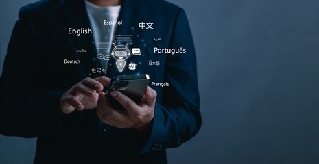Businessman using smartphone with AI chatbot interface and multilingual translation icons. Concept of artificial intelligence communication, language translation technology and smart mobile assistant © PB Studio Photo