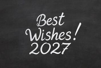 Obraz premium best wishes 2027 text number new year handwritten greetings on a blackboard chalkboard hand written, cursive, handwriting chalk writing