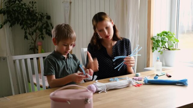 Happy Children Laugh and Fun Make DIY Toys. Kids Crafting from Fluffy wire, Bending Plush. Craft Pipe Cleaners. Leisure on Holidays. Thick Fluffy Chenille Stems for Arts. Supplies, Chenille Stems.