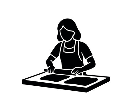 Solid icon of a person wearing an apron using a rolling pin across two flattened pieces on a workboard for baking or clay work.