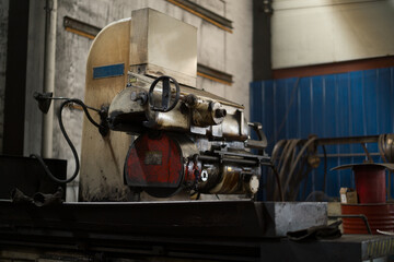 M7140 surface grinding machine in an industrial workshop setting