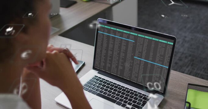 Woman analyzing code monitoring energy with data initiating animated eco power icons around laptop