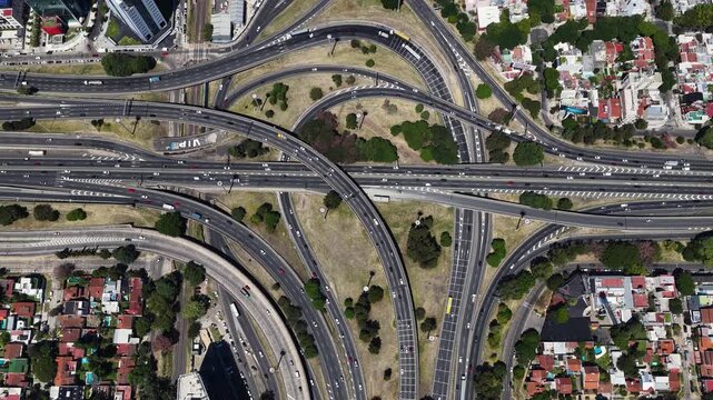 BUENOS AIRES, ARGENTINA - FEBRUARY 27, 2026: Aerial vertical view of heavy traffic on Illia highway with the city skyline in the background.