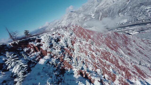 Snowy mountain and red rocks, winter FPV video, high speed dive, Glenwood Springs 4K