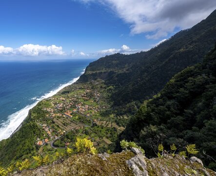 Ridge of Pico do Alto, view of coast and sea with village Arco de Sao Jorge, Madeira, Portugal