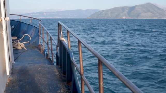 Side of a trawler boat going through the waves