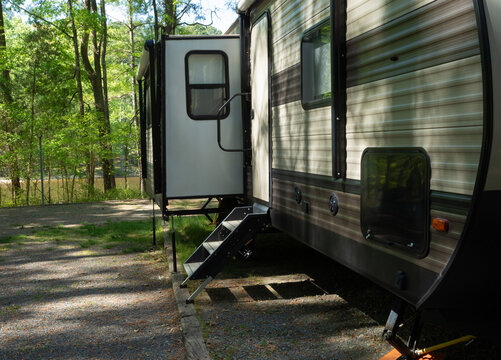 Slideout extended on a travel trailer at a campsite