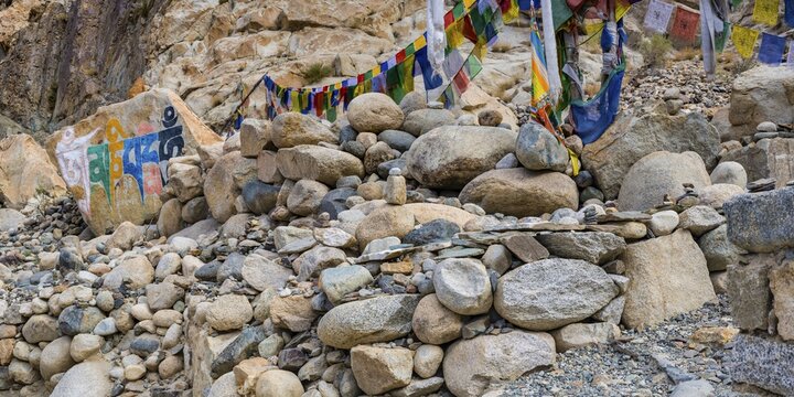 Mani stones with the engraved Tibetan mantra Om Mani Padme Hum, Nubra Valley, Ladakh, Jammu and Kashmir, India