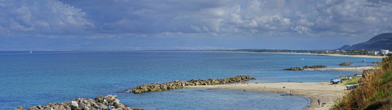Sandy beach beach with turquoise sea at the Grotte Piedigrotta, Pizzo, Calabria, Italy