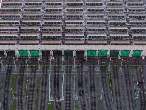 Aerial view of the green doors and train tracks below form a rhythmic pattern, a symphony of industrial design, Rome, Lazio, Italy.