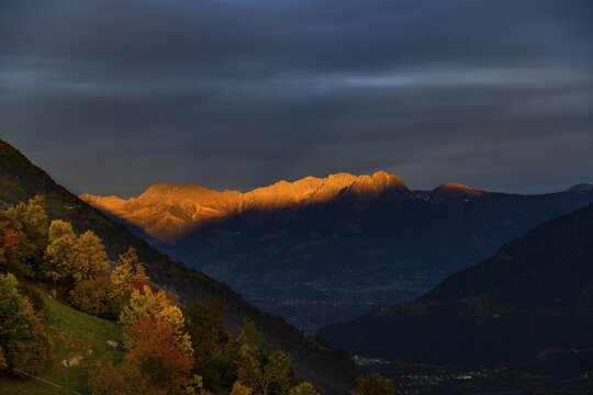 Sunset over Merano with reddish shining Merano mountains, Merano, South Tyrol, Italy
