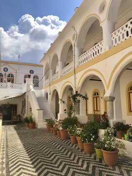 Inner courtyard with flowers, Monastery of Archangel Panormitis, Symi, Dodecanese, Greece