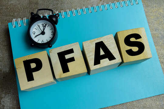 Concept of text PFAS - Per- and polyfluoroalkyl substances on wooden blocks.