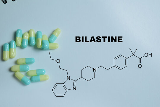 Concept of bilastine antihistamine medication write on book isolated on Wooden Table. For allergy treatment histamine H1 receptor blocker, relief of allergic rhinitis and urticaria symptoms
