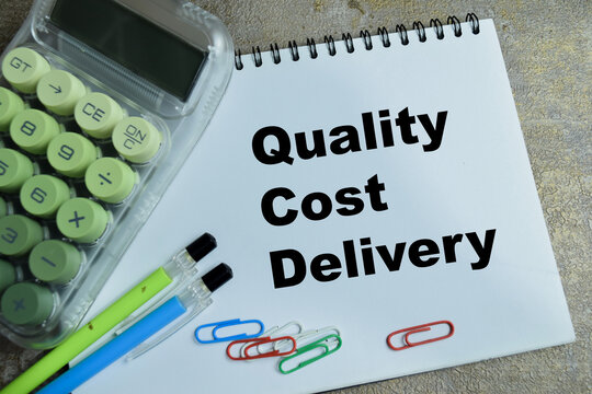 Concept of quality cost delivery write on book isolated on Wooden Table. For professional business leadership and operations