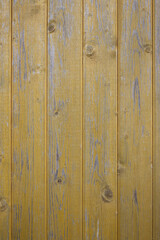 Fototapeta premium Weathered yellow wooden boards texture background with natural wood grain