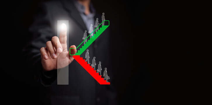 K-shaped economy recovery concept. A businessman touches the graph showing the divergence between the thrive and decline sectors or industries. Uneven, split economic rebound following a recession.