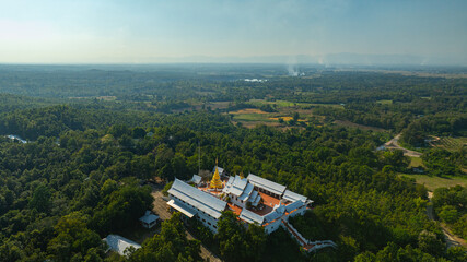Wat Phra That Pu Jae is a significant historic temple in northern Thailand. The centuries old square chedi enshrines a sacred relic of the Buddha and stands as an important cultural © Narong Niemhom