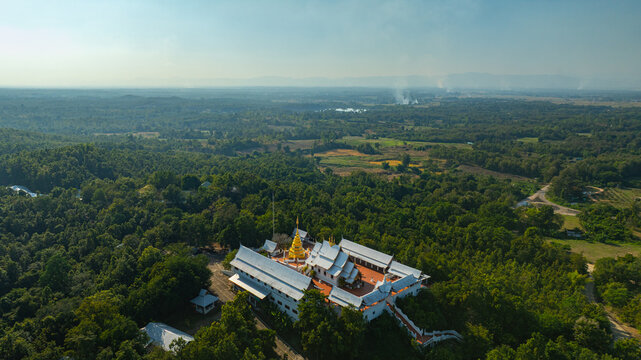 Wat Phra That Pu Jae is a significant historic temple in northern Thailand. The centuries old square chedi enshrines a sacred relic of the Buddha and stands as an important cultural