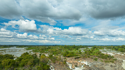 Khone Phapheng Waterfall, the largest waterfall on the Mekong River, features powerful multi-tiered cascades rushing over massive rock formations, creating one of the most dramatic natural © Narong Niemhom