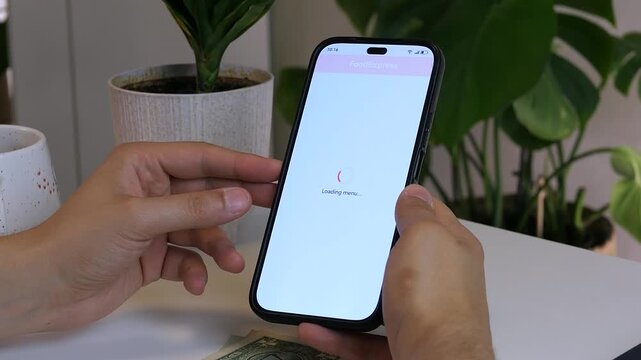 Seamless online food ordering experience on a smartphone. A person picks a pizza and adds it to the cart in a sleek mobile application. Essential footage for modern lifestyle, consumer behavior trends
