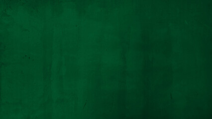 Fototapeta premium Dark forest green textured wall background with subtle plaster brush strokes. Deep emerald painted concrete surface for elegant moody interior design or artistic backdrop mockup with copy space.