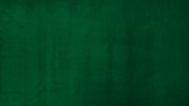 Dark forest green textured wall background with subtle plaster brush strokes. Deep emerald painted concrete surface for elegant moody interior design or artistic backdrop mockup with copy space.