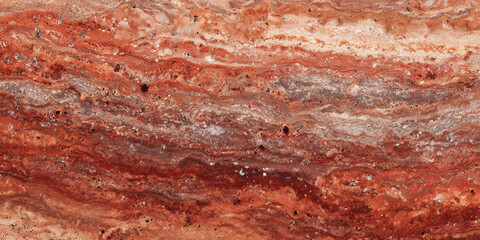 Rich warm red travertine texture of polished slab. Natural stone background shows detailed layered surface pattern