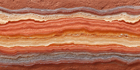 Obraz premium Tranquil abstract background of red and orange sedimentary rock texture. natural, colorful layer shows earth geology