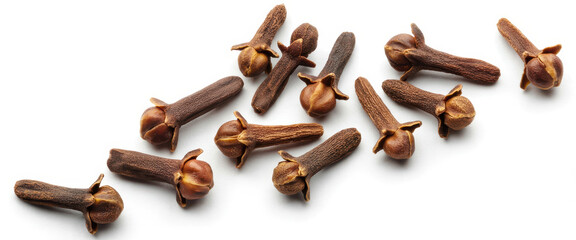 Dried cloves on white surface spice brown